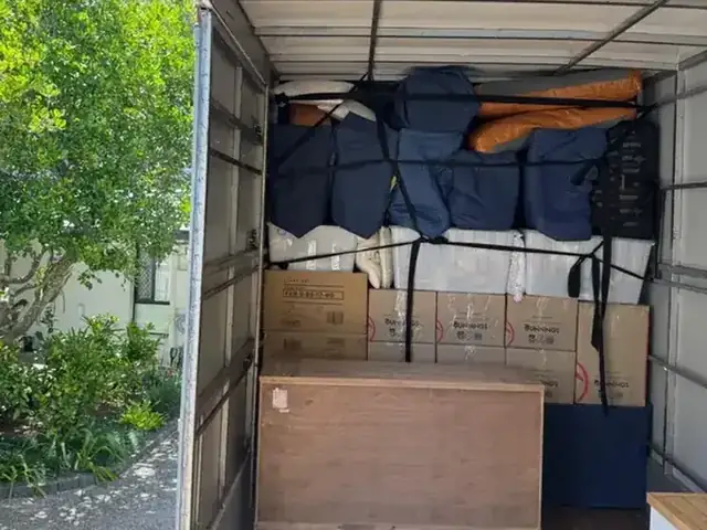 Furniture and boxes carefully packed and strapped inside a Safepack removal truck