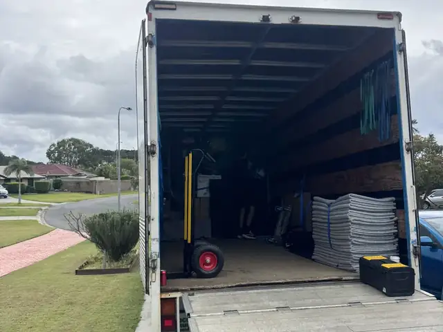 Safepack removal truck with ramp down at a Gold Coast home, ready to load furniture