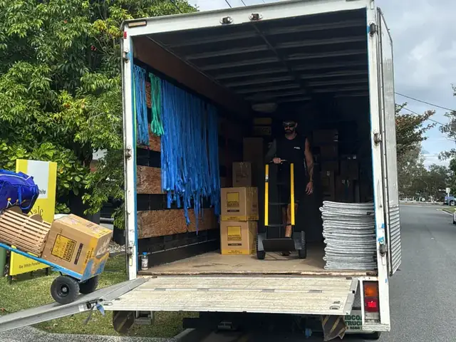 Back of a loaded Safepack removal truck parked on a Gold Coast street
