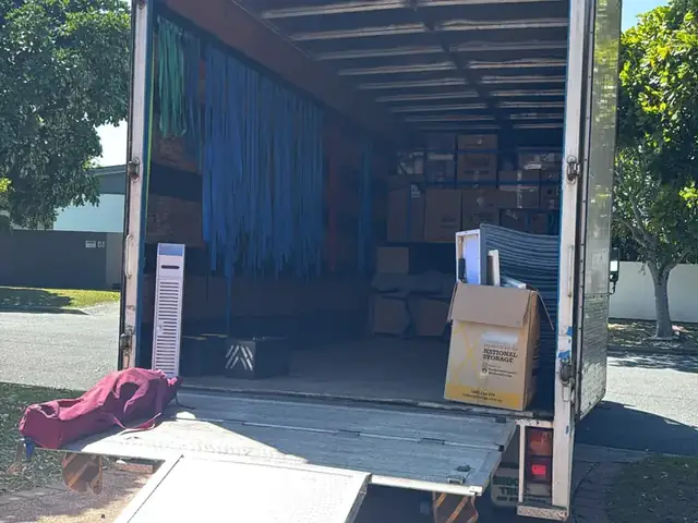 Back of a Safepack removal truck open on a sunny Gold Coast driveway
